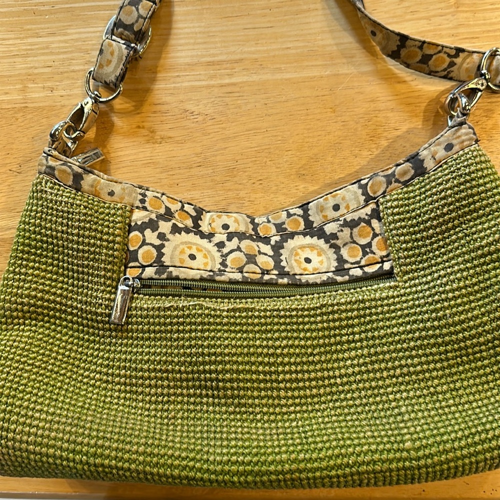 Very good condition vintage style bag in green cloth material w/ shoulder strap.